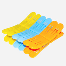 Double pin plastic clips in multicolour for strong cloth holding.