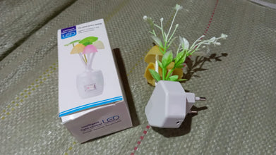 LED night light with automatic on/off and color-changing capabilities.